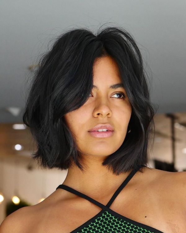 chin-length black bob parted in the middle