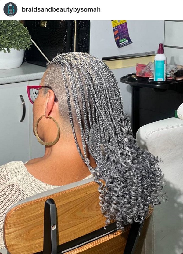 gray braids shaved head curly ends