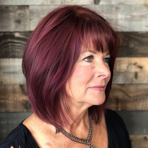 layered medium hair cut with bangs for woman over 60