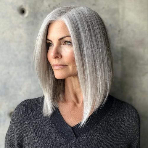 sophisticated gray face-framing long bob haircut for older women