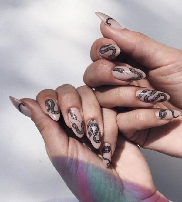 beige-nail-design-oval-shape-with-black-snakes-on-both-hands