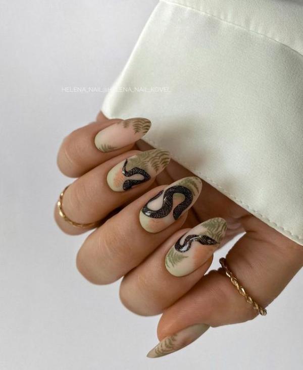 beige-nails-with-snakes-and-leaves