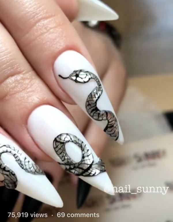 long-acrylic-stiletto-nails-with-glitter-silver-snake