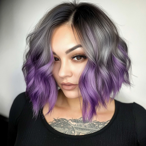 Vibrant purple bob hairstyle featuring a chic and modern edge