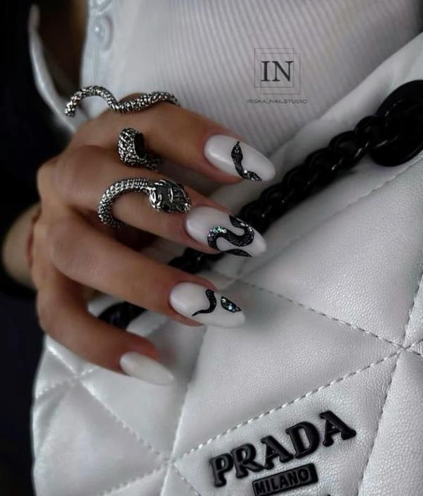 white-oval-nails-with-glitter-and-snake