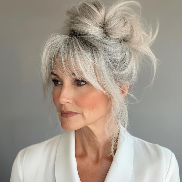 older woman messy bun with bangs hairstyle