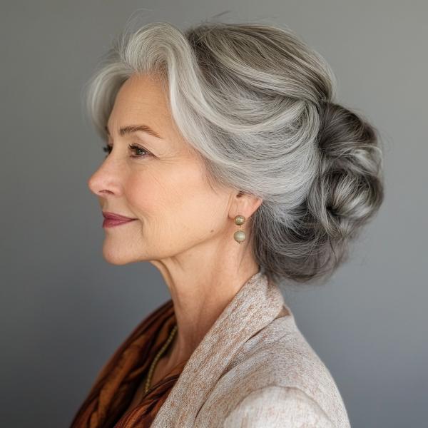 older woman low bun with front waves of hair