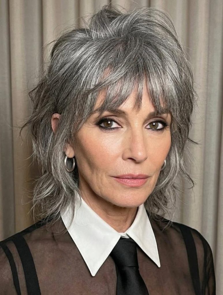 Modern Gray Wolf Cut Showcasing a Lifted, Voluminous Crown and Lighter Textured Ends