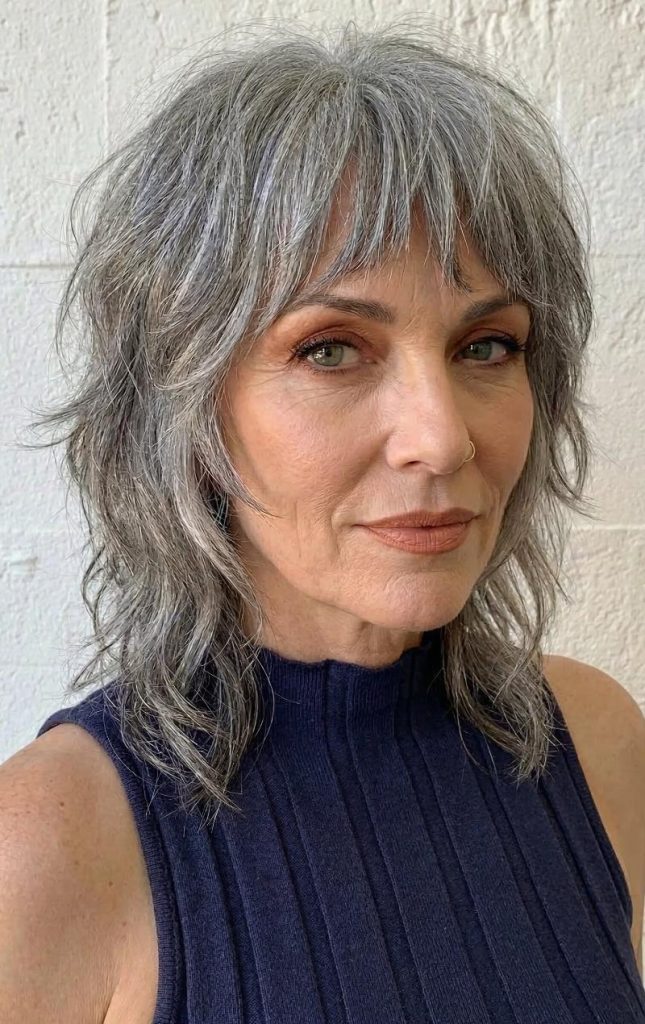 Edgy Gray Wolf Cut Featuring Bold, Choppy Bangs and Contemporary Layered Texture