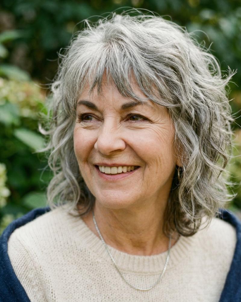 Tousled Gray Wolf Cut Styled on Wavy Hair for a Relaxed, Slightly Undone Look