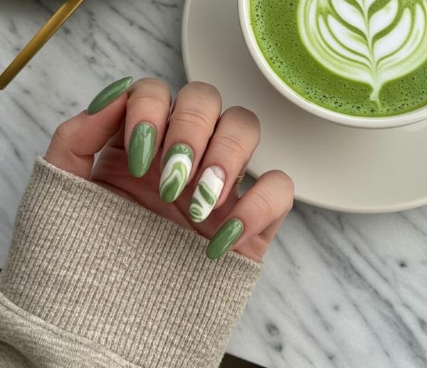 Matcha Nail Art with Abstract White Swirls